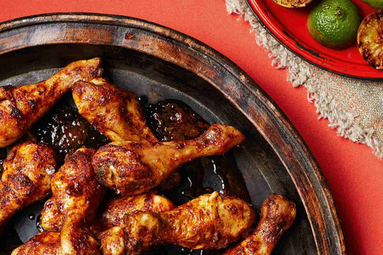 Grilled Chicken Drumsticks on a Brown Plate