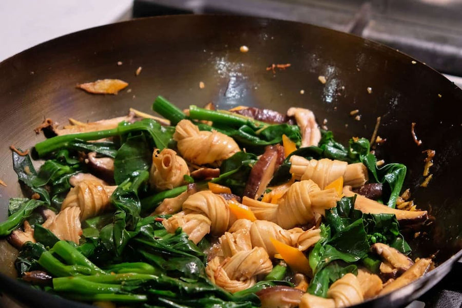 Fried Chinese broccoli, dried shitake mushrooms and dried beancurd knots with XO sauce