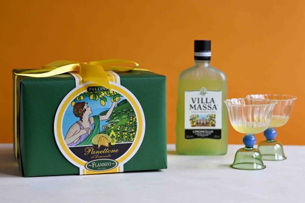 Flamigni Limoncello panettone in a box with a bottle of limoncello and two glasses